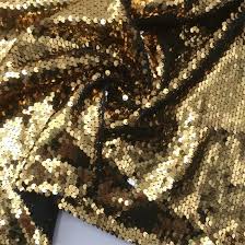 Sequin fabric is a type of textile embellished with small, shiny discs, known as sequins, which are often made from plastic or metal.