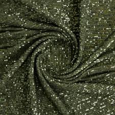 Sequin fabric is a type of textile embellished with small, shiny discs, known as sequins, which are often made from plastic or metal.
