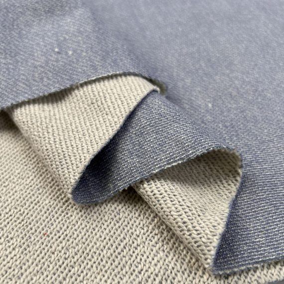 Terry fabric is a type of textile characterized by its looped pile surface, which is created by weaving extra threads into the fabric.